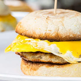 Enjoy a fresh breakfast sandwich with sausage and egg from The Place in Glendale, AZ
